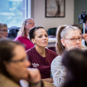womens classroom Women in a classroom setting focused on the the instructor at the front of the room